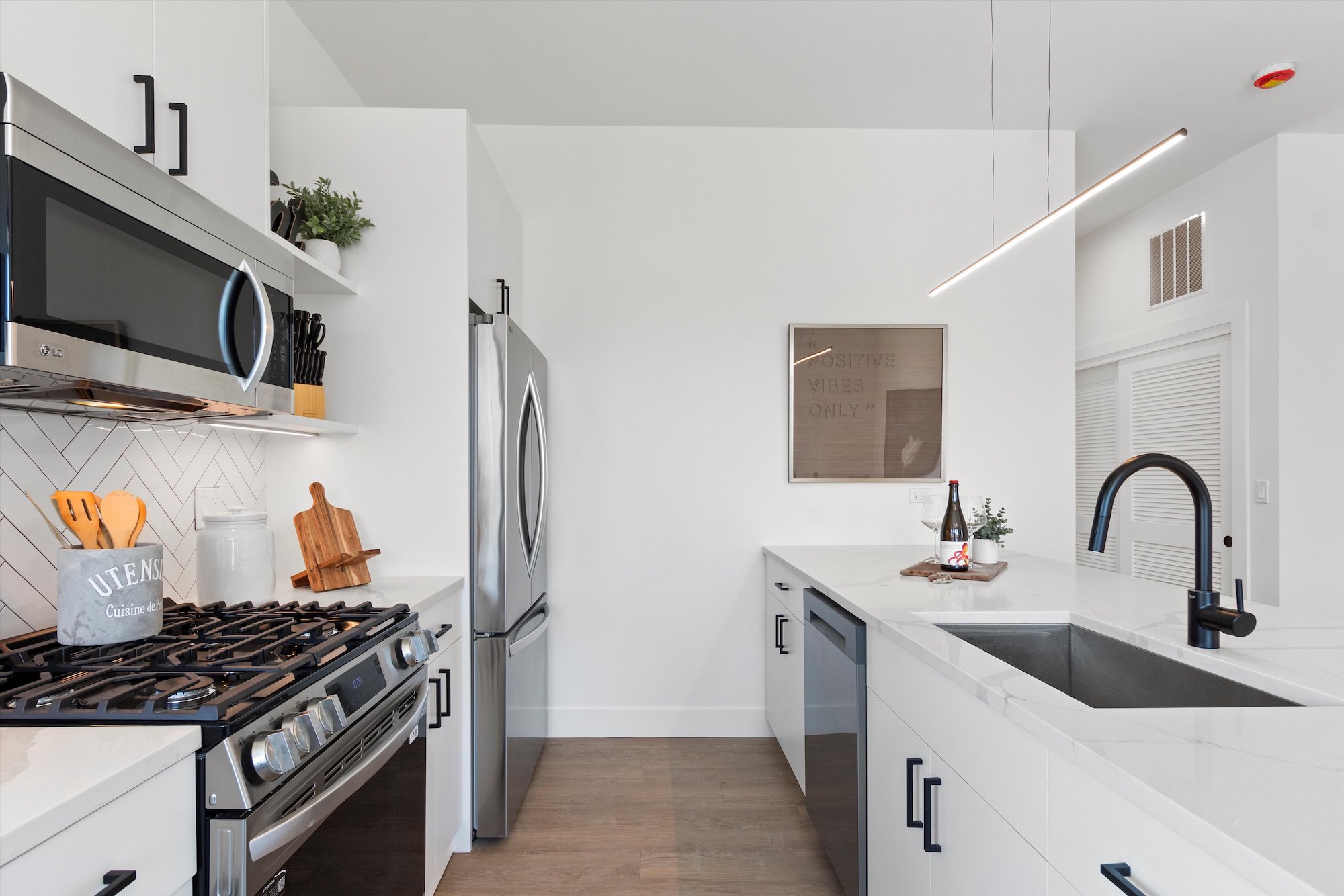A modern kitchen at 3140 Clybourn, brand new apartments in Roscoe Village Chicago.