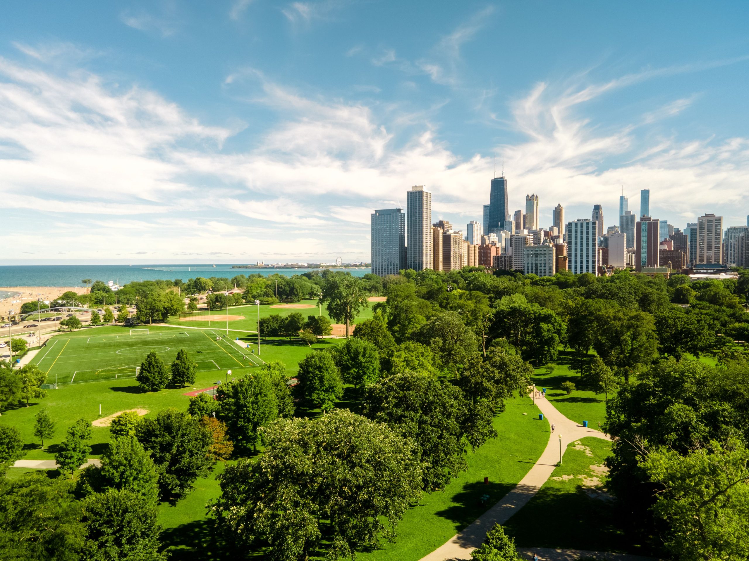 An aerial of the Lincoln park in Chicago with a display of skyscrapers and lake Michigan, the USA